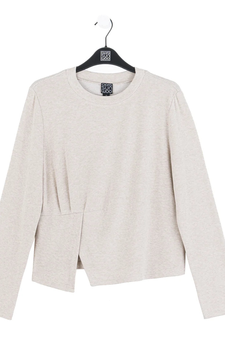 Light gray blazer on a hanger with a white background