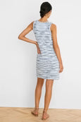 Woman wearing a sleeveless dress with a white background