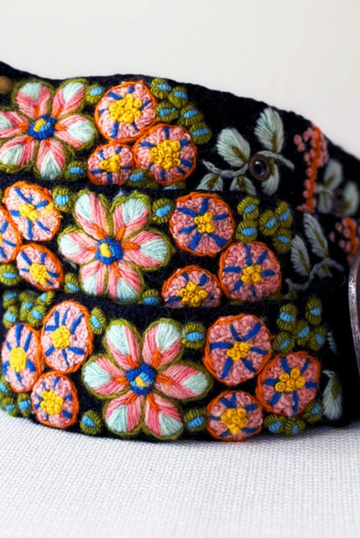 Colorful floral embroidery belt on a white background