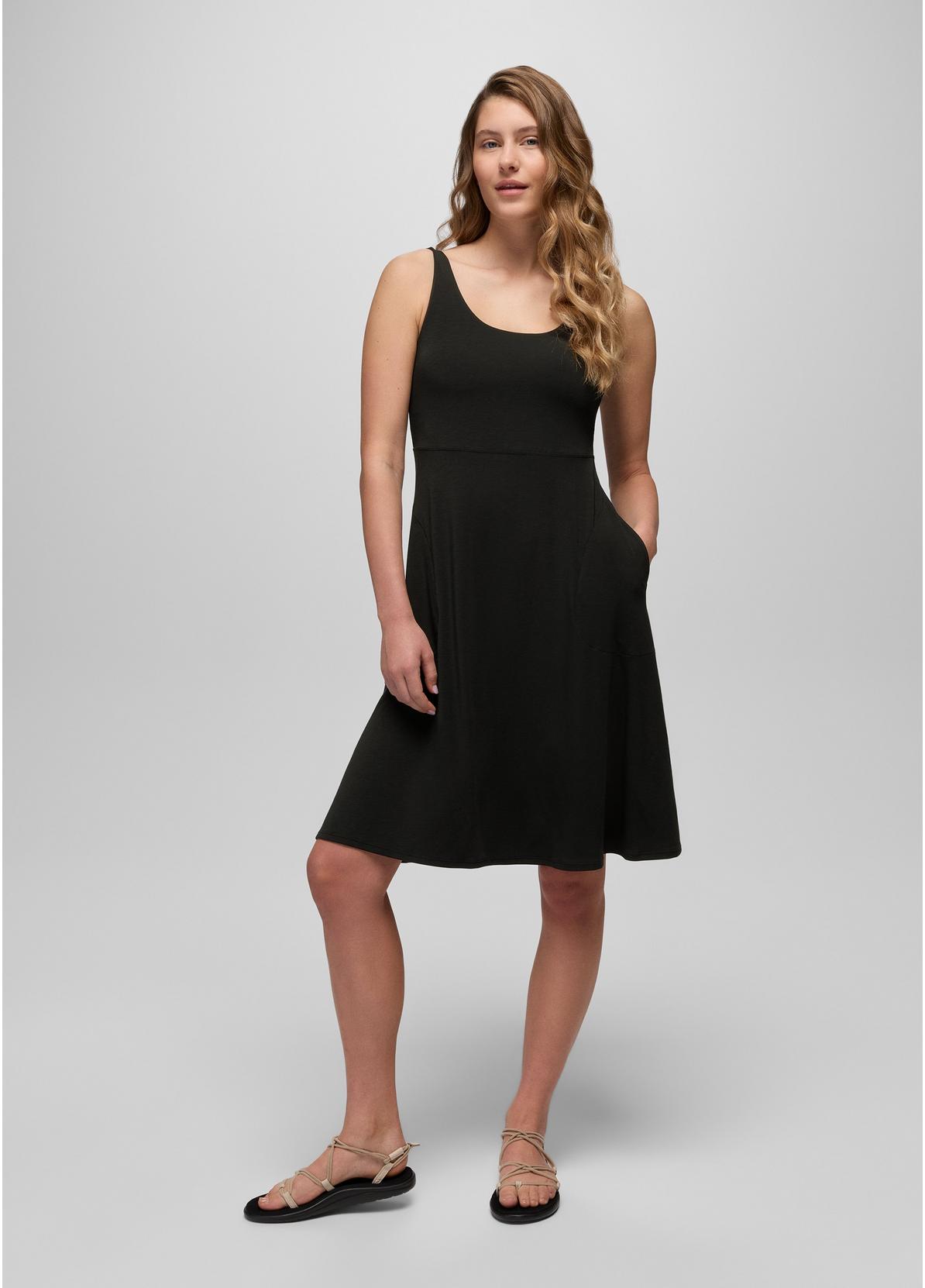 Woman wearing a black dress on a white background