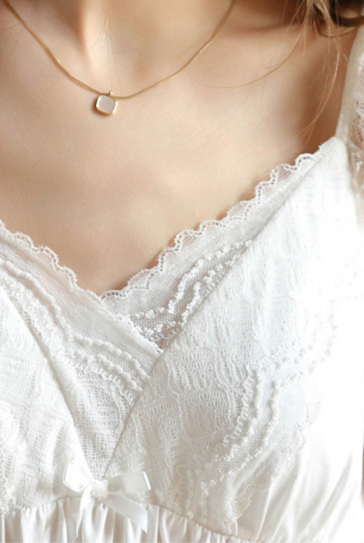 Close-up of the lace trim neckline with built-in bra support