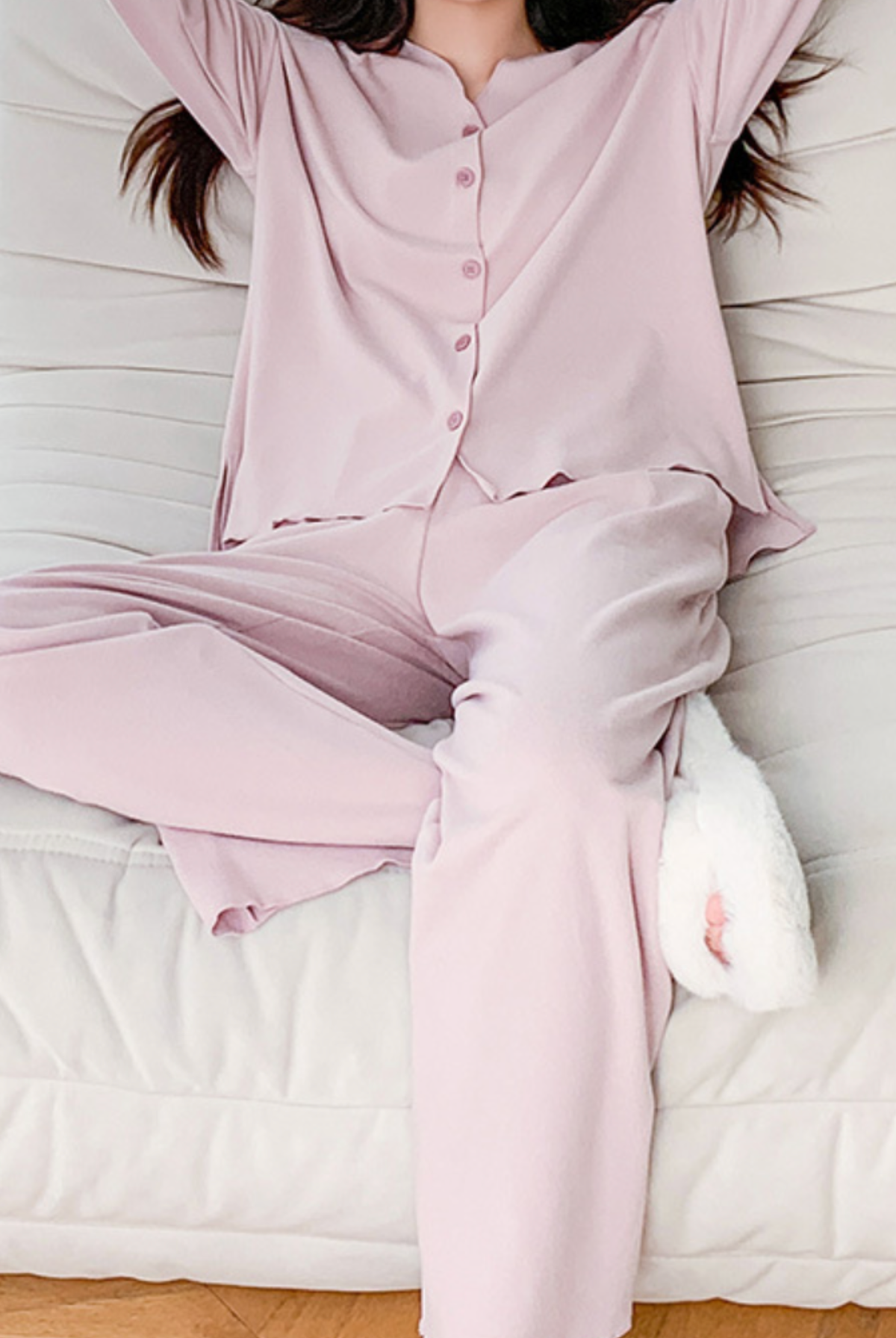 Dusty pink modal pajama set worn while relaxing