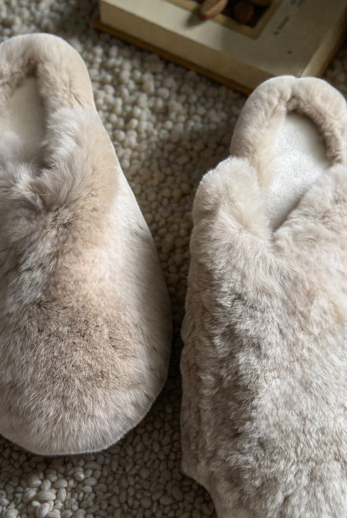 Side angle of the fluffy beige rabbit fur slippers