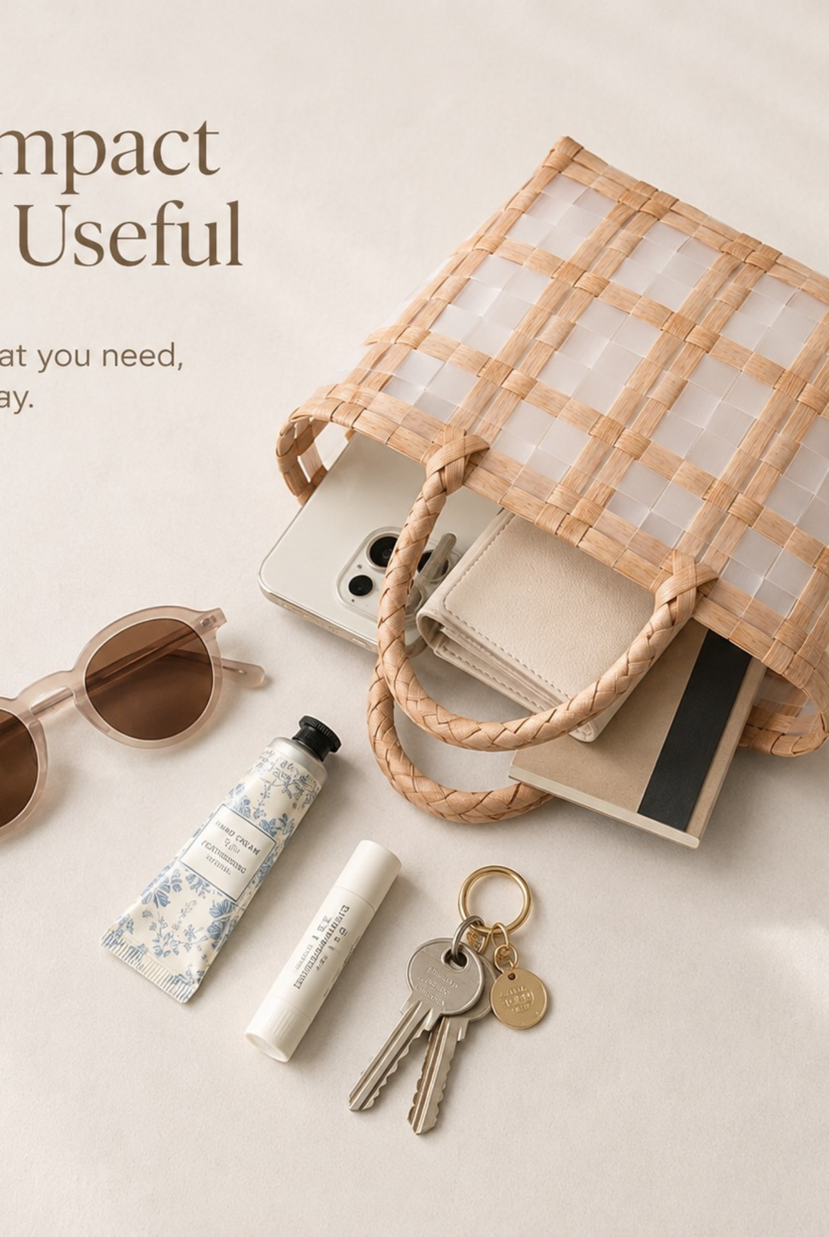 Beige woven tote shown with sunglasses, keys, and everyday essentials