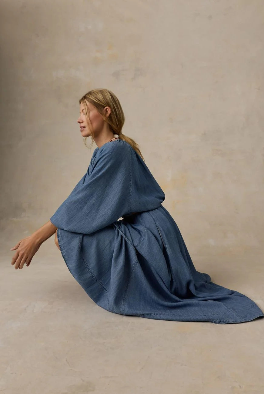 Faherty Brand Tried & True Chambray Nera Skirt lifestyle shot — women's sustainable maxi skirt in River Mist Wash showing full drape and movement