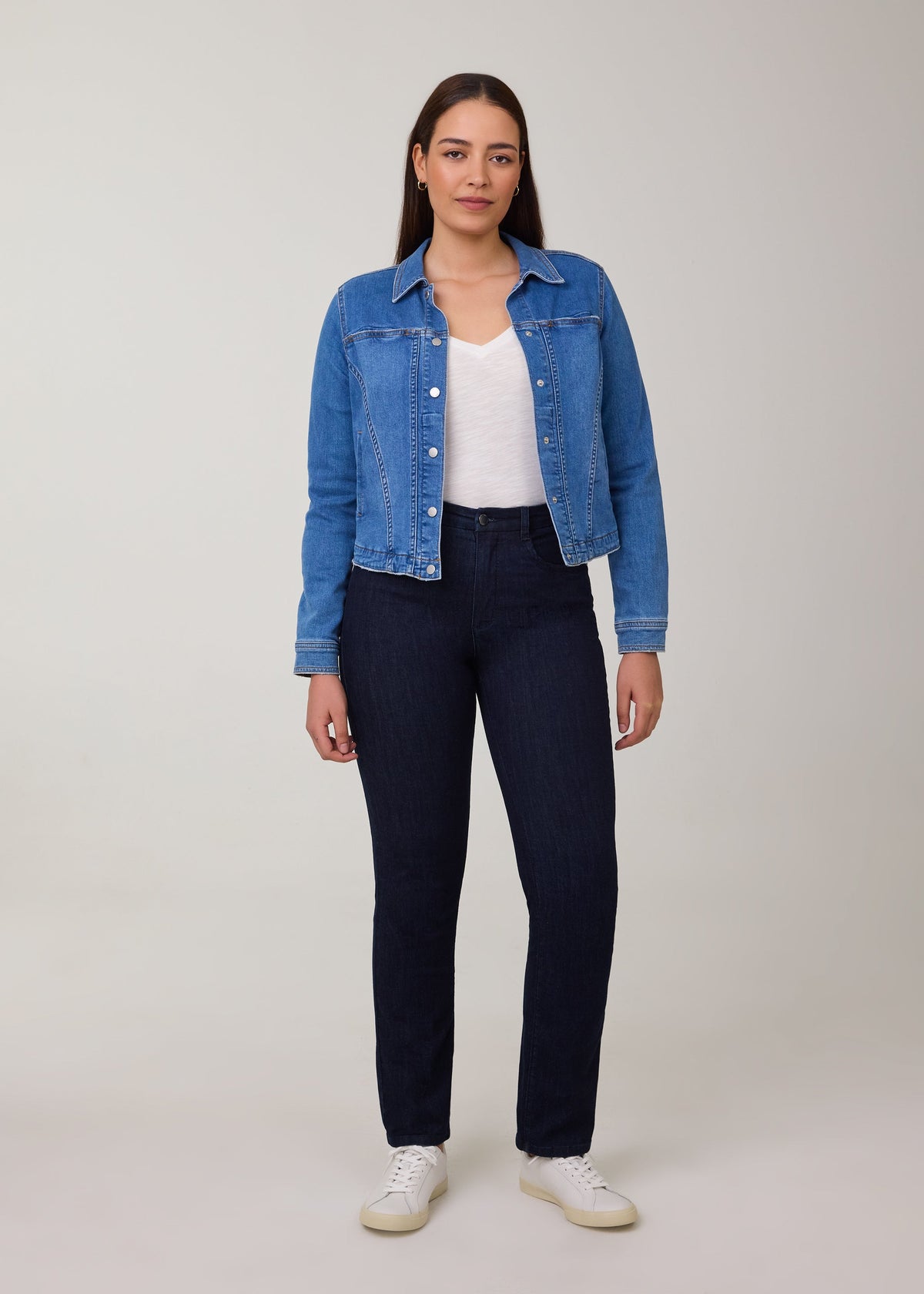Model wearing FDJ Petite Suzanne Straight Leg Jeans in Pleasant dark wash with a denim jacket, white tee and white sneakers, full-length front view