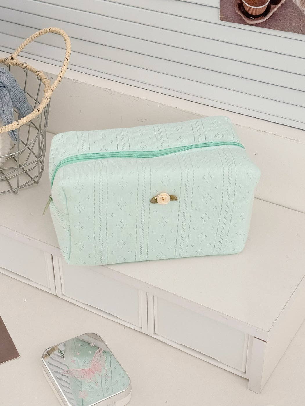 Mint green textured cosmetic pouch with rose detail