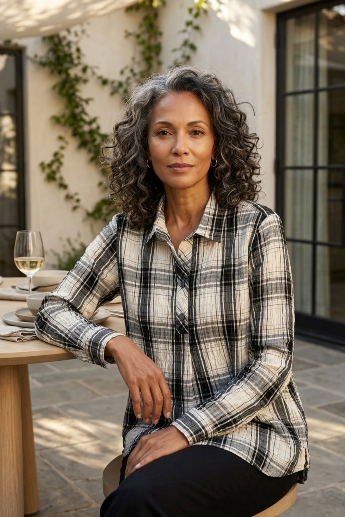Habitat Crinkle Windowpane Chill Pullover in winter white plaid, styled seated on an outdoor patio