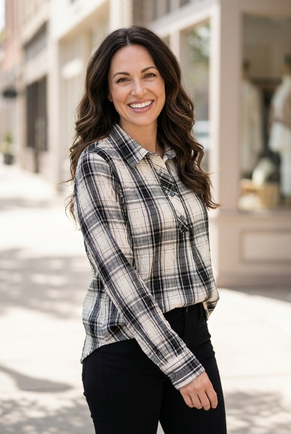 Habitat Crinkle Windowpane Chill Pullover in winter white plaid with sleeves pushed up, worn with black pants