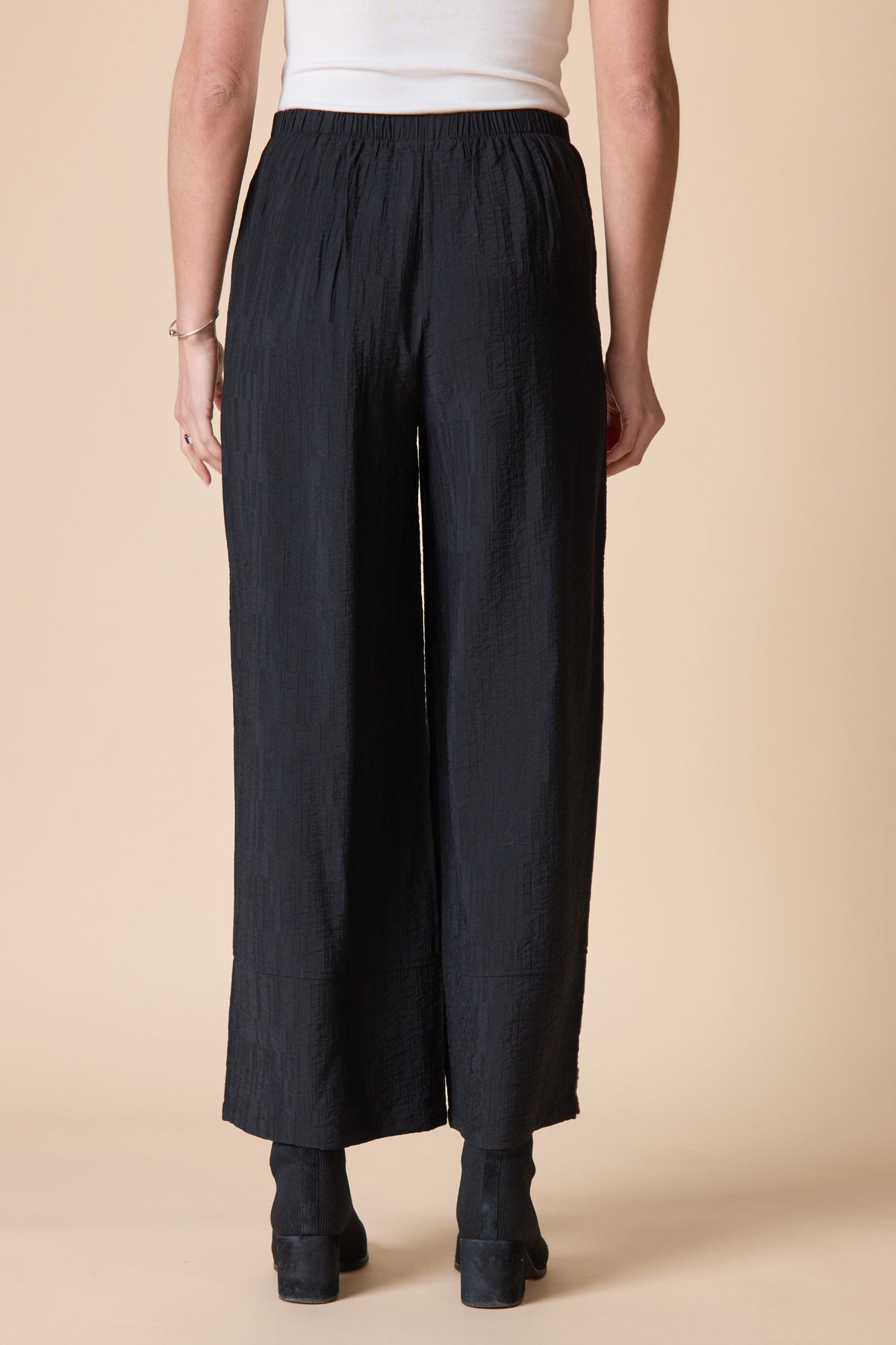 Back view of the Habitat Rayon Jacquard Button Hem Pant in black wide leg
