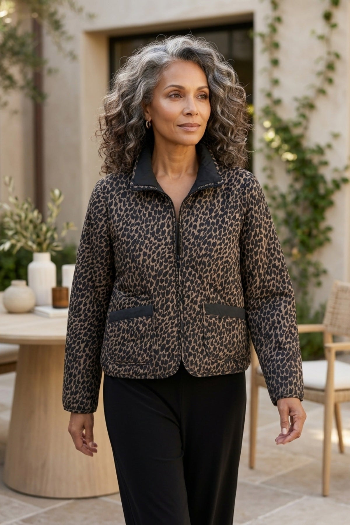 Habitat Reversible Print Quilt Puffer Coat worn animal print side out with black pants