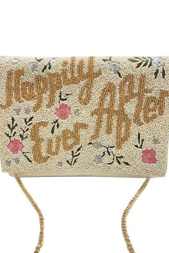 A rectangular clutch bag covered in beige beads with the phrase 'Happily Ever After' in brown script, decorated with pink flowers and green leaves, featuring a gold chain strap.