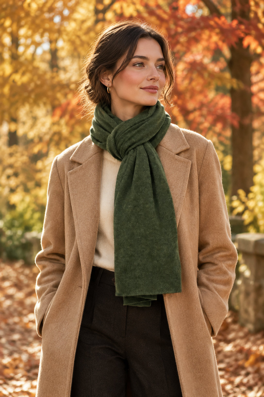 Model wearing the In Cashmere Classic Cashmere Scarf in Heather Pine, a deep green 100% cashmere