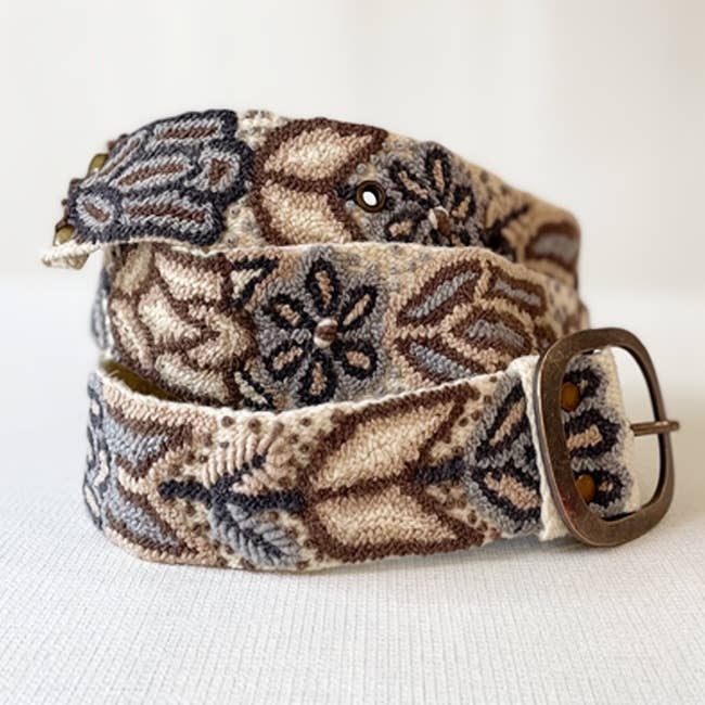 Jenny Krauss Monochromatic Embroidered Wool Belt in cream, coiled to show the hand embroidery