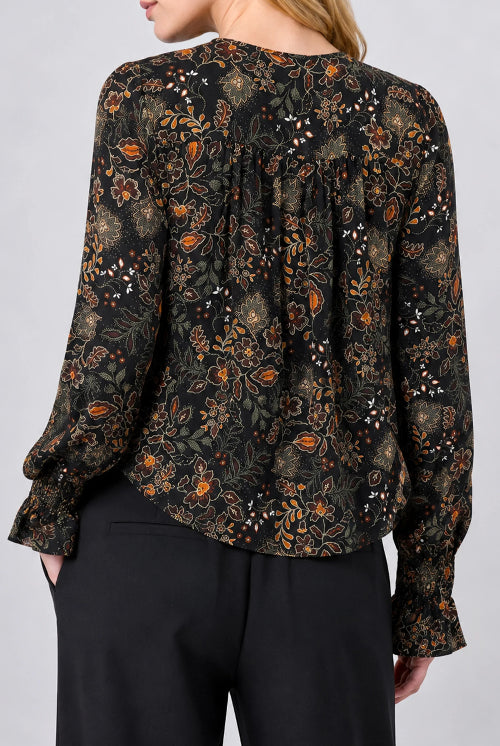 Back view of the Long Sleeve Woven Blouse with Pintucks in Black Rust floral, gathered back yoke with ruffled cuffs