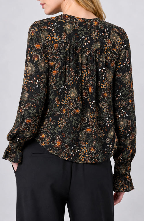 Back view of the Long Sleeve Woven Blouse with Pintucks in Black Rust floral, gathered back yoke with ruffled cuffs