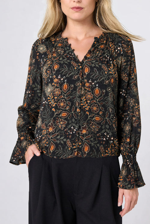 Front view of the Long Sleeve Woven Blouse with Pintucks in Black Rust floral, V-neck button front with smocked cuffs