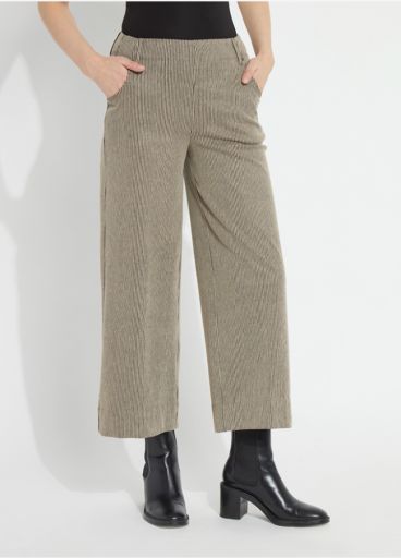 Model wearing the Lysse Clarke Wide Leg pant in olive-taupe Everwood Sheen Line stripe, cropped length, with black ankle boots