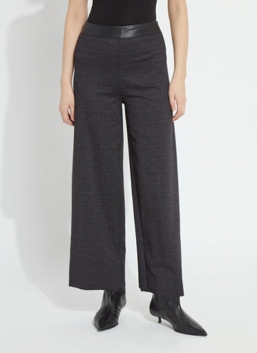 Model wearing the Lysse Denver Hi Waist Wide Leg Printed Ponte pant in charcoal Midnight Manor plaid with black ankle boots