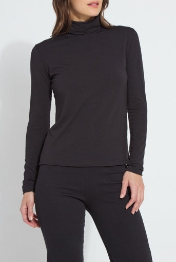 Model wearing the Lysse Essential Longsleeve Turtleneck in black with black pants