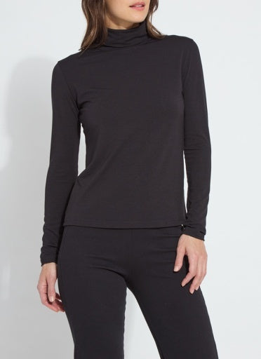 Model wearing the Lysse Essential Longsleeve Turtleneck in black with black pants