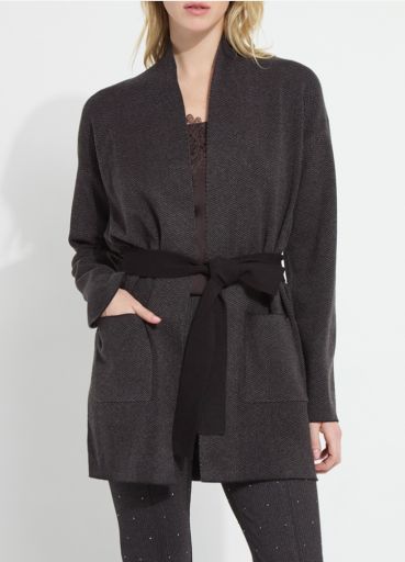 Model wearing the Lysse Laila Double Faced Belted Cardigan in black and grey melange with a black tie belt and patch pockets