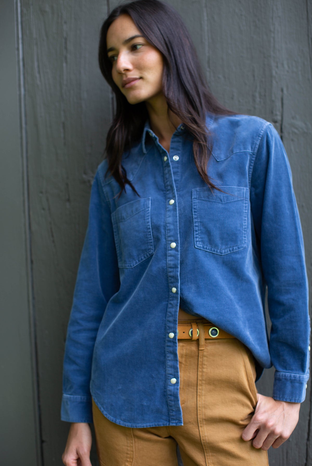 Marea Corduroy Western Shirt in Indigo with snap front, tucked into camel trousers
