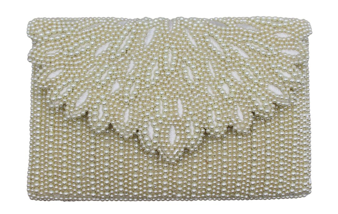 A rectangular clutch bag covered in cream-colored faux pearls and beadwork, featuring a scalloped beaded flap on a plain white background.