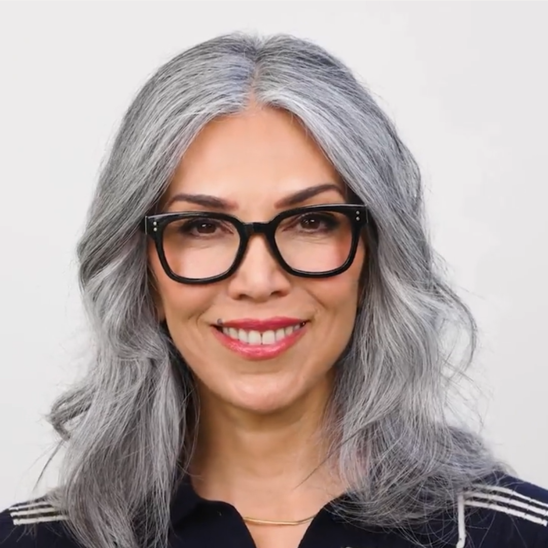 Woman wearing Peepers Aubrey blue light reading glasses in black