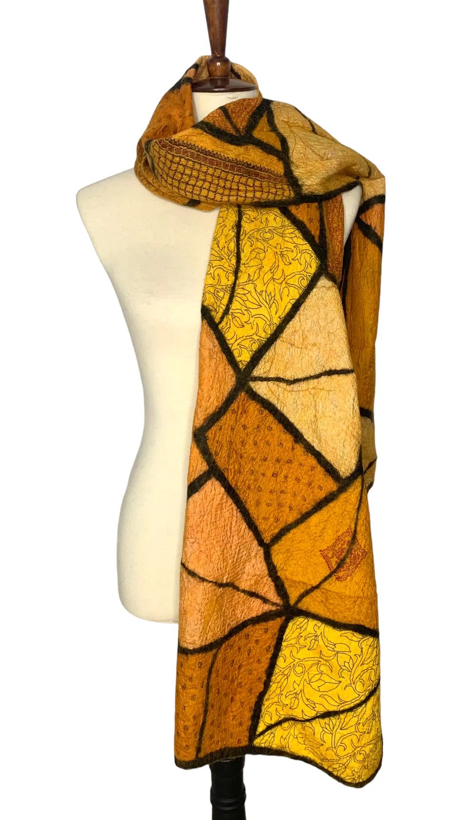 Pomegranate Moon Sari Patchwork scarf in gold, amber and saffron felted silk patches with dark seams, displayed on a dress form