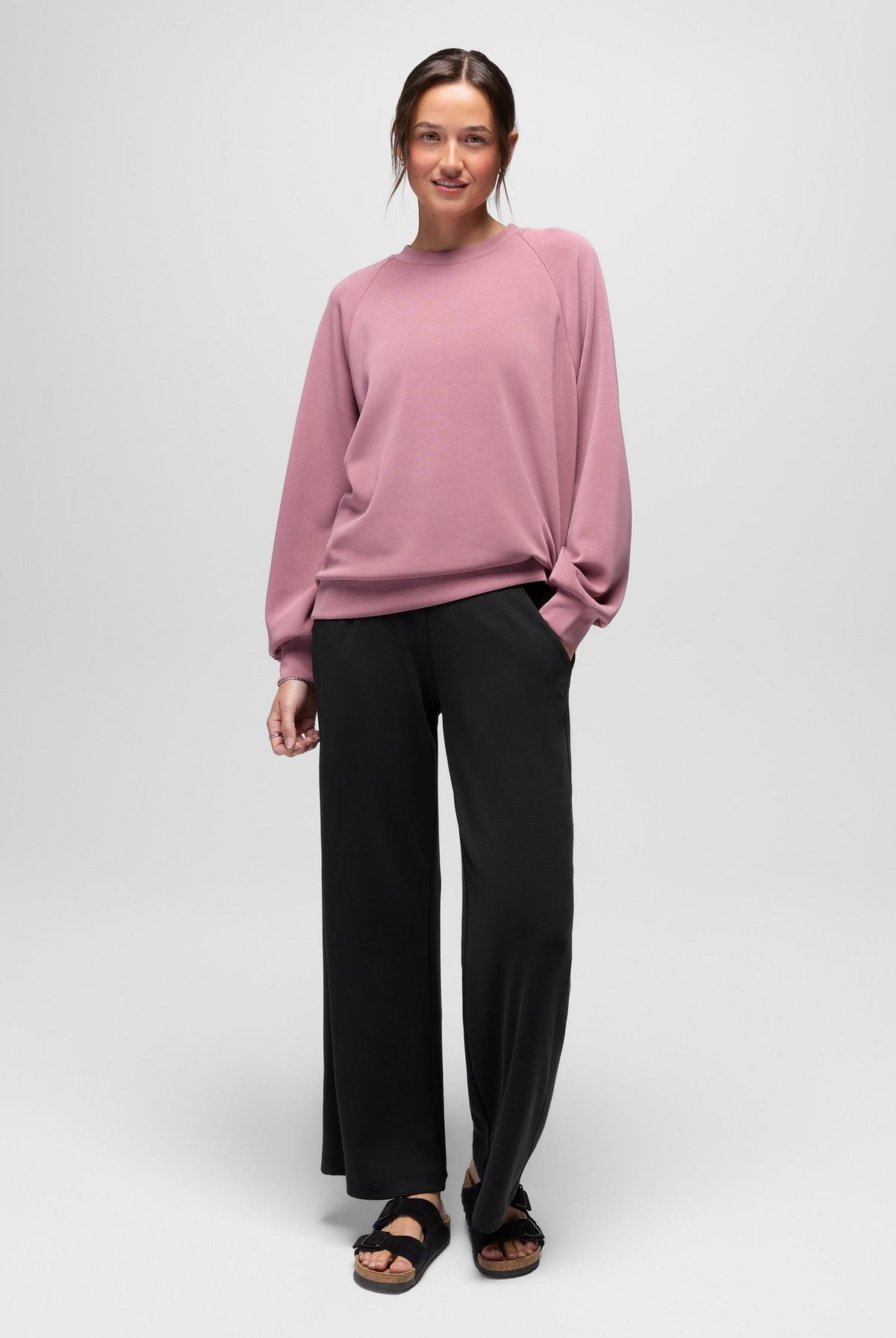 prAna Shea Soft Wide Leg Pant in Black, full-length view styled with a pink sweater