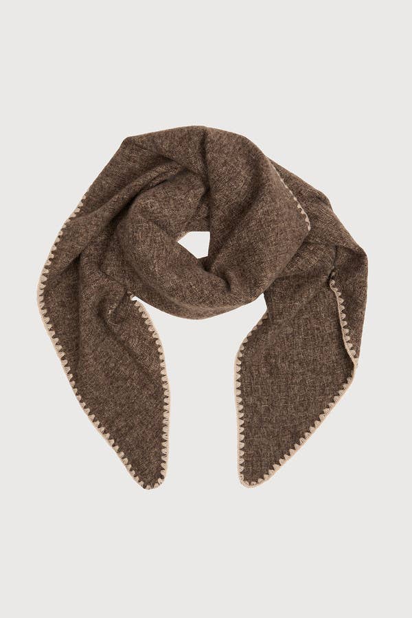 Taupe knitted triangle shawl knotted at the neck