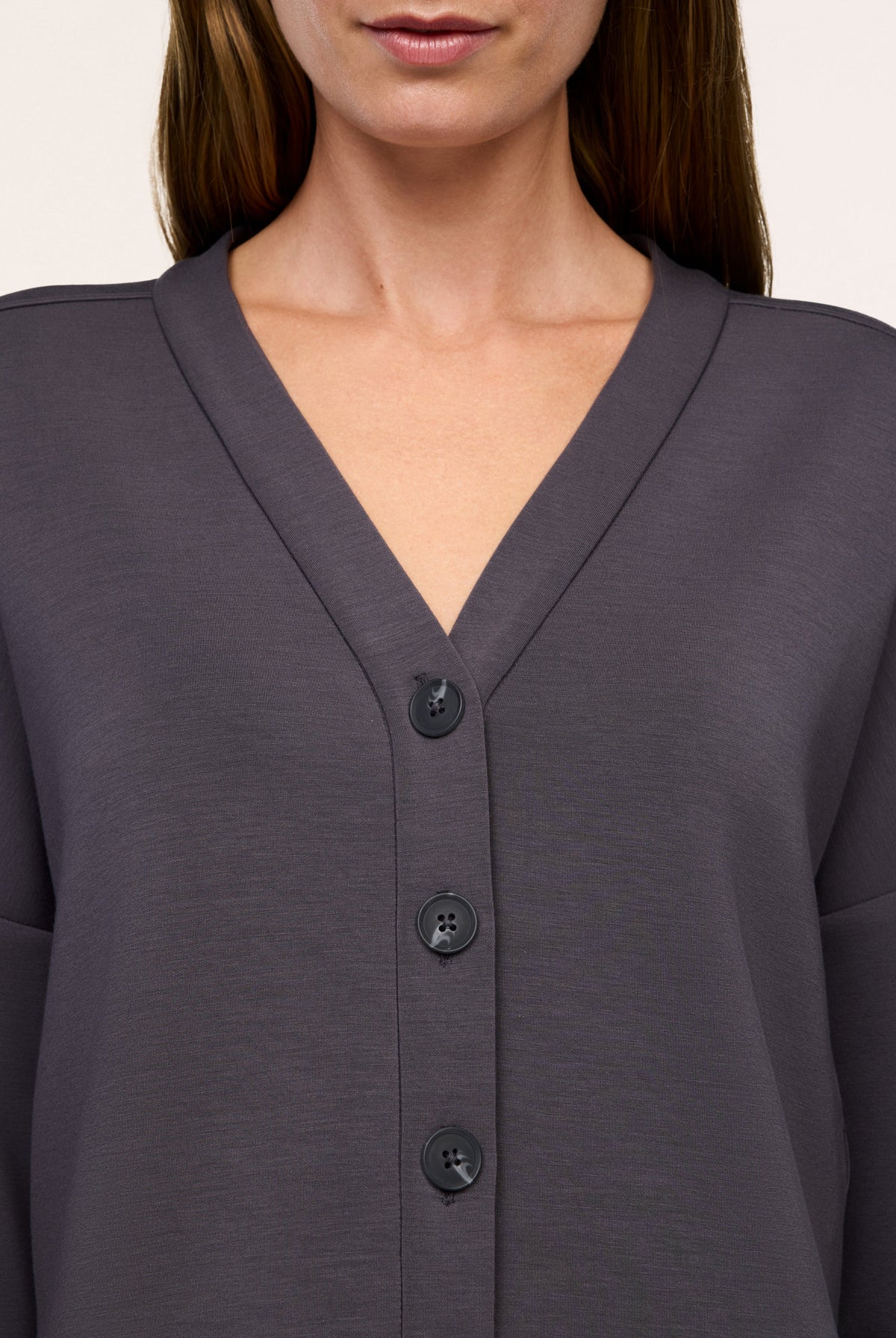 Close-up of the V-neckline and buttons on the SPANX AirEssentials Cardigan in Dark Slate gray
