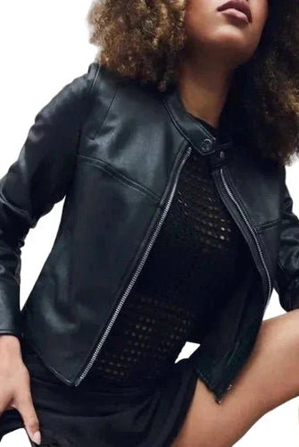 Spanx cropped leather-like moto jacket in Luxe Black, front view on model