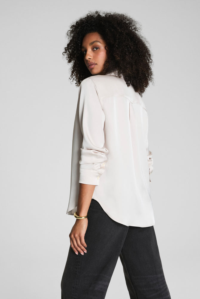 SPANX Silky Smooth Button Down in Birch soft ivory, back view showing the curved high-low shirttail hem