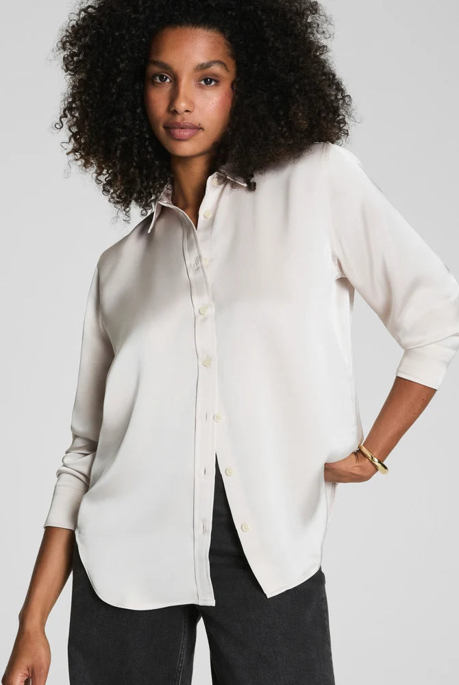 SPANX Silky Smooth Button Down in Birch soft ivory with black pants, relaxed-yet-tailored fit, front view