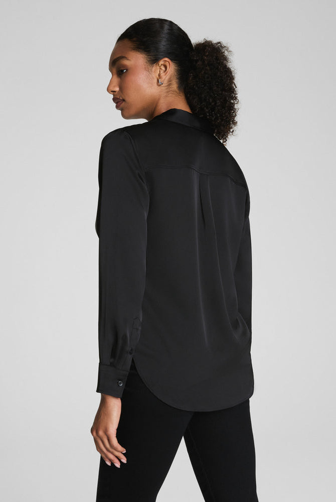 SPANX Silky Smooth Button Down in Classic Black, back view with relaxed drape and shirttail hem