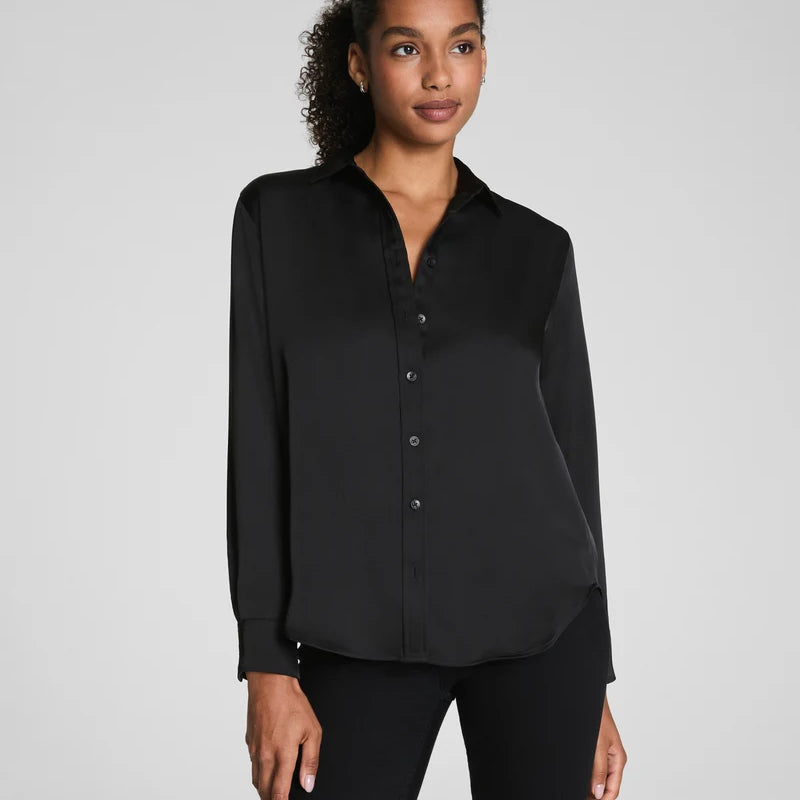 SPANX Silky Smooth Button Down in Classic Black with black pants, traditional collar and button front, front view