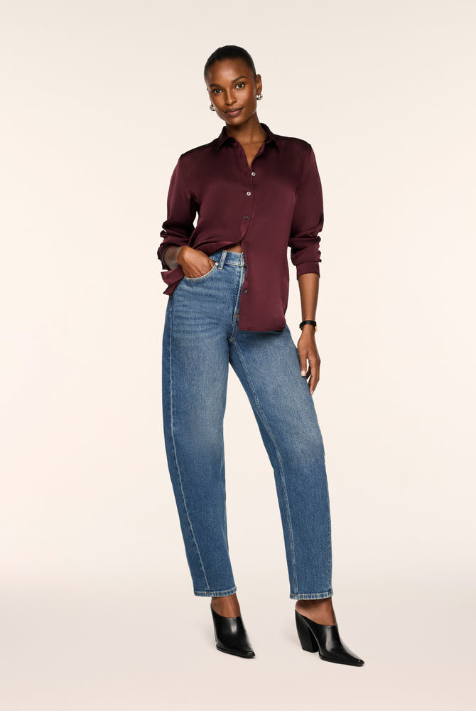 SPANX Silky Smooth Button Down in Fig Noir deep wine, half-tucked into straight leg jeans with black heeled boots, full-length view