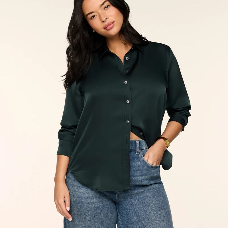 SPANX Silky Smooth Button Down in Night Forest deep green, half-tucked into jeans, front view