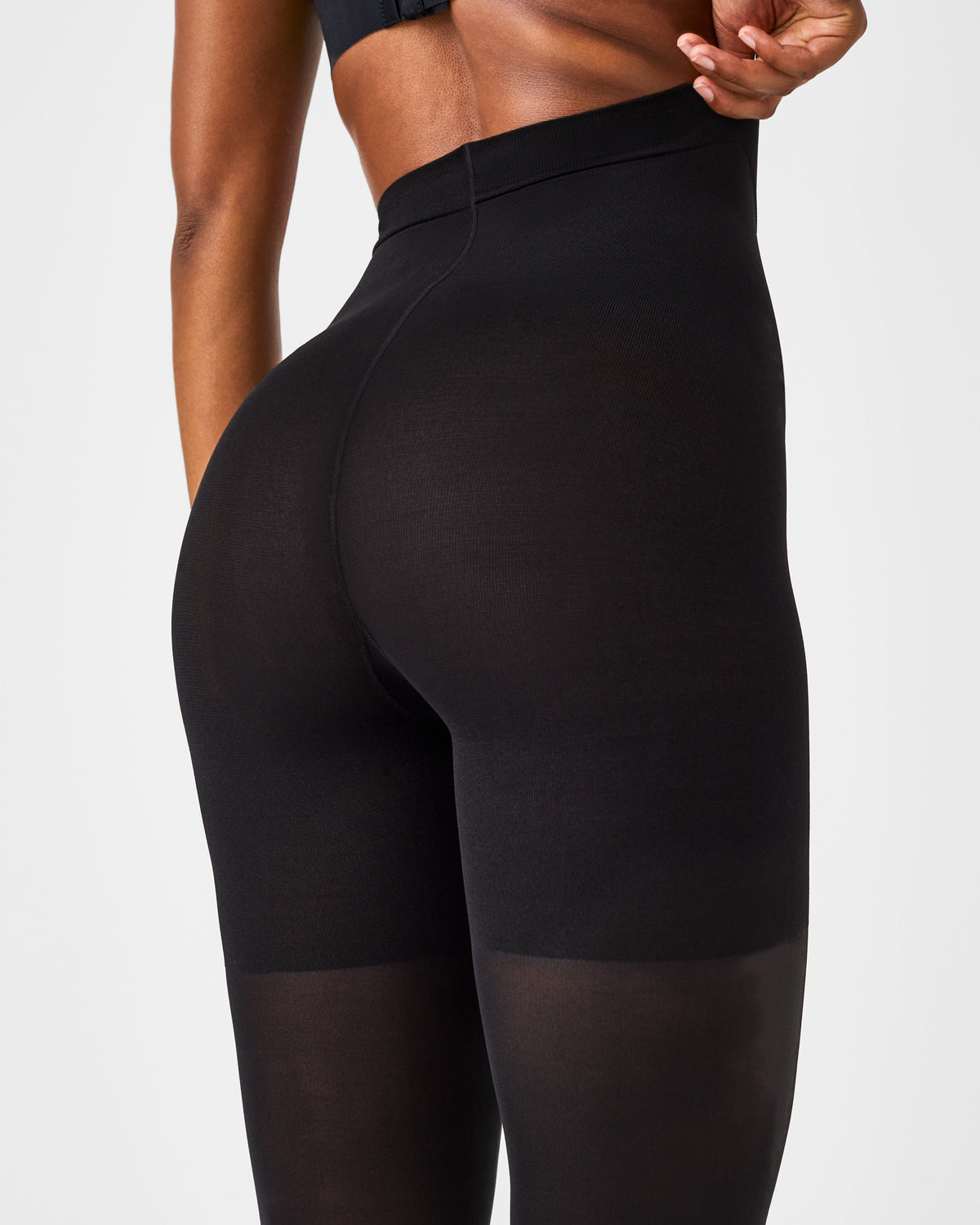 Close-up back view of SPANXshape Mid-Thigh Tight-End Tights in Very Black showing the lifting mid-thigh shaper
