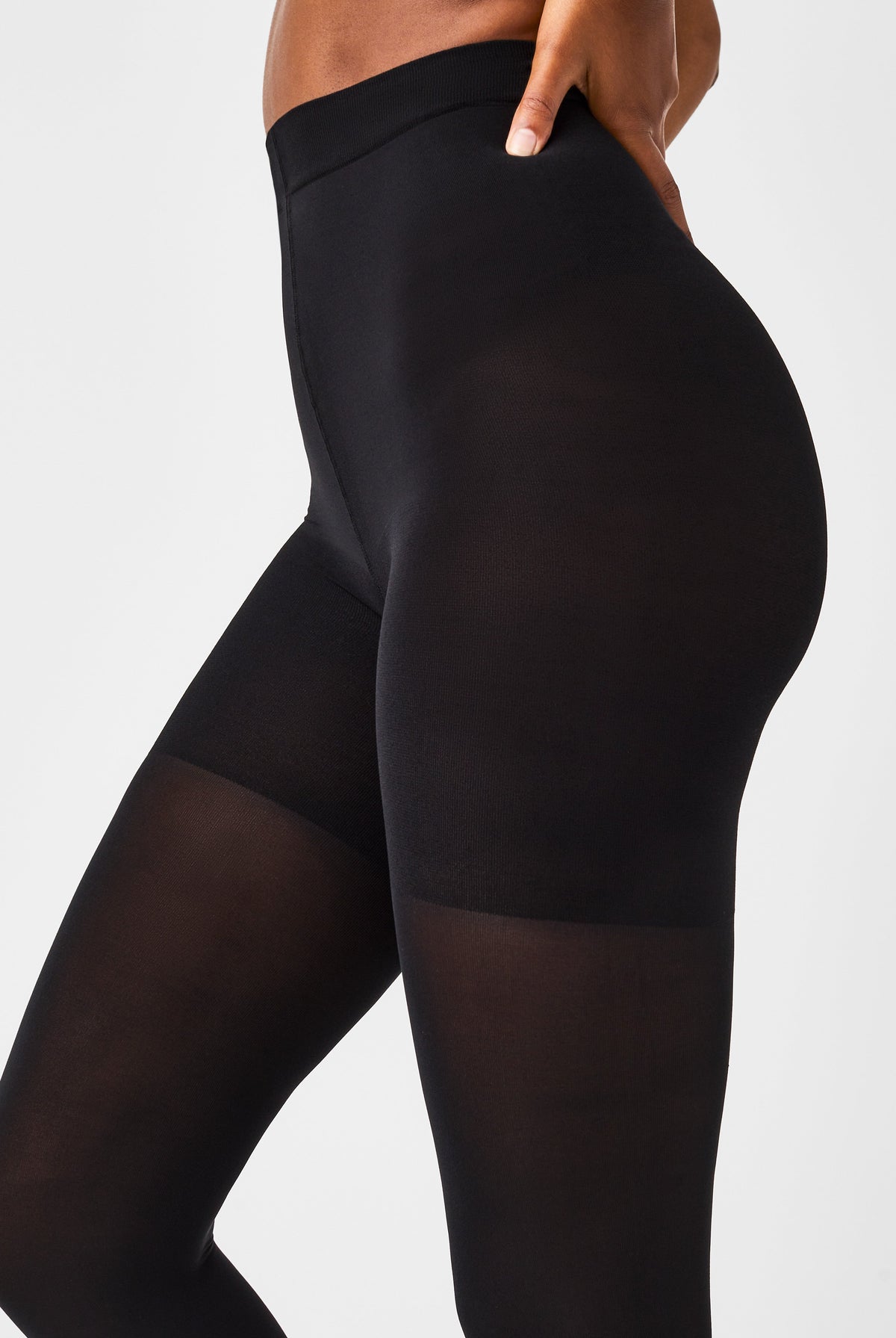 SPANXshape Mid-Thigh Tight-End Tights in Very Black, side view of the smooth high waistband and opaque leg