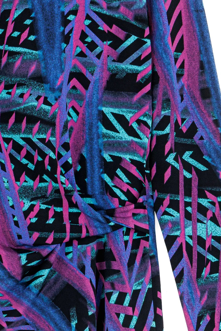 Close-up of top with a vibrant, multicolored pattern on a white background
