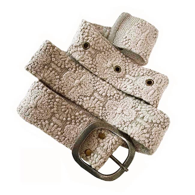 beige wool belt with a metal buckle on a white background