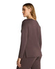 Side view of a woman wearing a dark cacao brown boatneck tunic with matching lounge pants