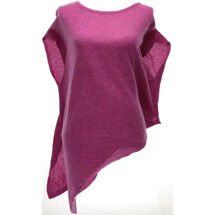 A magenta pink knit poncho top with a subtle glitter texture, featuring a crew neck and asymmetrical draped sleeves, shown against a plain white background.