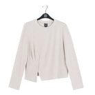 Light gray blazer on a hanger with a white background