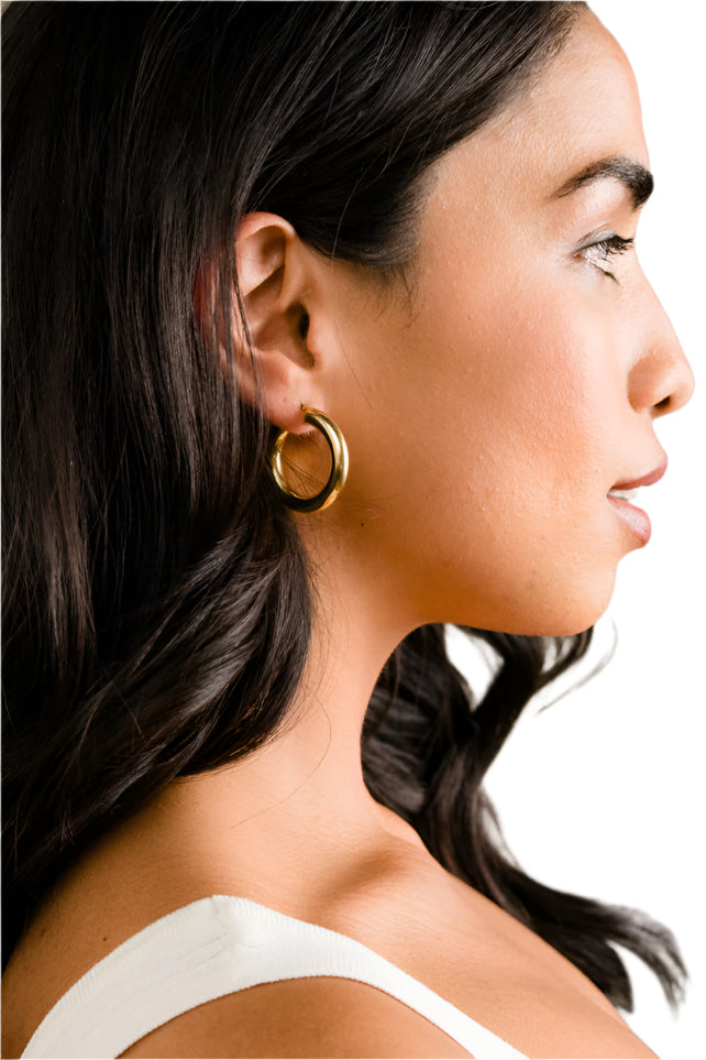 ABLE Air Hoops lightweight tube hoop earrings, shown on model
