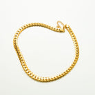 Gold-tone chunky flat snake chain necklace with a clasp, shown flat on a white background