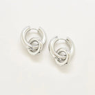 Silver interlocking hoop earrings on a white background